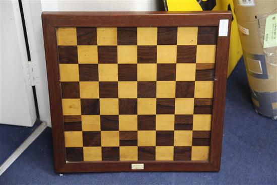 A Jaques & Son Staunton boxwood and ebony chess set, kings 4.25in., board 22 x 21.75in.